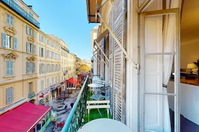 a balcony with a view of a street with buildings at Silver Suite Five Stars Holiday House in Nice