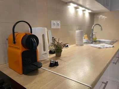an orange toaster sitting on a counter in a kitchen at Super studio in the heart of Nice! in Nice