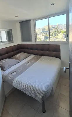 a window with a view of a city at Sea View Apartment in Nice
