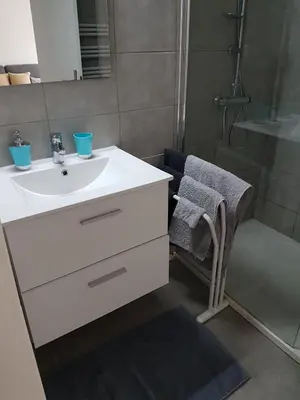 a bathroom with a white sink and a shower at Sci MDM in Nice