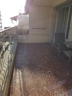 a patio with a table and chairs on a building at Sci MDM in Nice