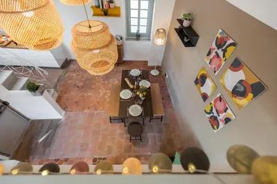 an overhead view of a living room with a table at Le Château - THE MOST BEAUTIFUL SIGHT IN OLD TOWN, private terrace in Nice