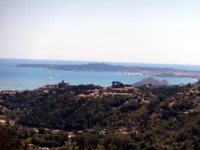 a view of a city and the water at La petite maison in La Gaude