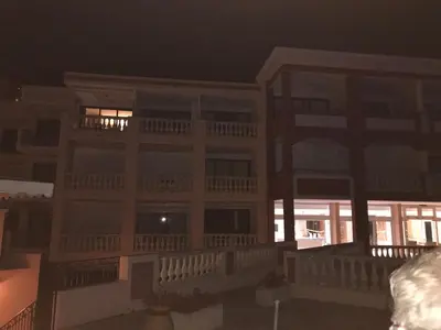 an apartment building at night with the lights on at Nice/Villefranche in Villefranche-sur-Mer