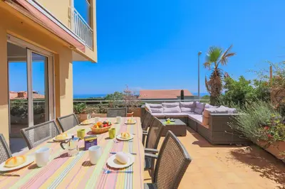 a patio with a table and chairs and a couch at HENRIETTA AP4070 - avenue Soleil d'Or - Villefranche-sur-Mer in Villefranche-sur-Mer