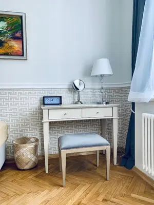 a desk with a stool and a table with a mirror at Villa Bagatelle - Luxury apartment in Nice