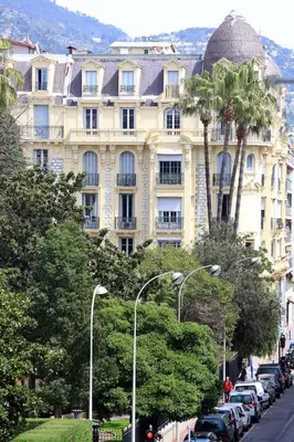a large building with cars parked in front of it at D’AZUR-35 in Nice
