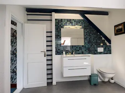 a bathroom with a sink and a toilet and a mirror at Nestor&Jeeves - TOUCAN DUPLEX TERRACE - Hyper center - Top floor in Nice