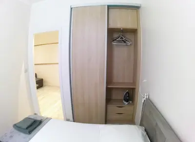 a bedroom with a closet with a bed and a mirror at Apartment in the heart of Nice in Nice