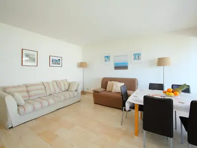 a bedroom with two beds next to a window at Apartment La Pinède-1 by Interhome in Cagnes-sur-Mer