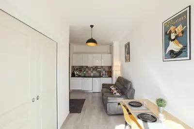 a living room with a couch and a table at Chic appartement Centre NICE au calme vue colline in Nice