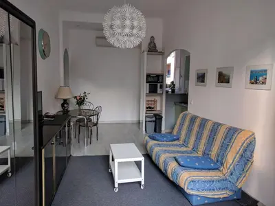 a living room with a couch and a table at Anderson apartment in Nice