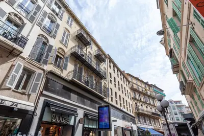 a street in a city with tall buildings at La Maioneta Carré d'Or in Nice