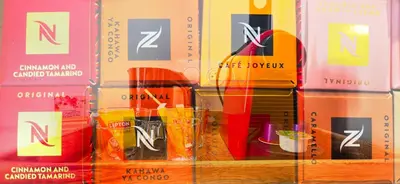 a stack of boxes with skateboards in them at Le Petit Trianon et le Charme des Suites in Nice