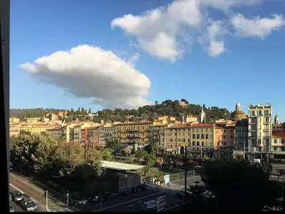 a view of a city with buildings and a cloudy sky at Belle Epoque Studio in Nice