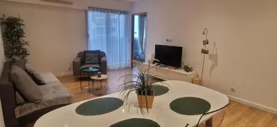 a living room with a couch and a table at Centre de Nice - Musiciens - Maréchal - Balcon 500m Promenade des Anglais in Nice