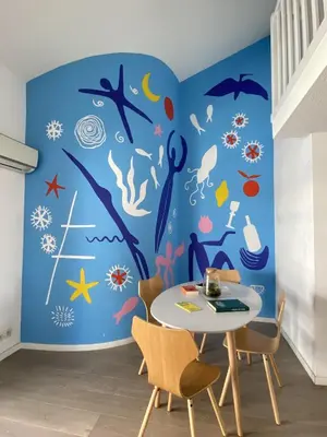 a dining room with a blue ocean themed wall at TOBIAS - Appartement Duplex 4 personnes Quartier Riquier Nice in Nice