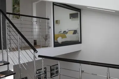 a bedroom with a bed and a mirror on the wall at Luxueux 3 Pièces - Wilson in Nice