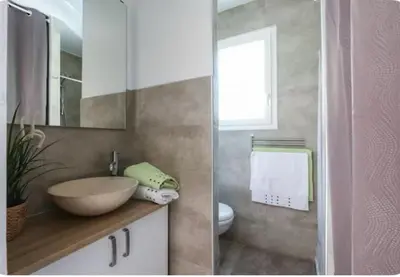 a bathroom with a bowl sink and a toilet at STUDIO pied village EZE - dans VILLA - Parking Gratuit in Èze