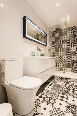 a white bathroom with a toilet and a mirror at Rossini Centre Ville - Proche Tram in Nice