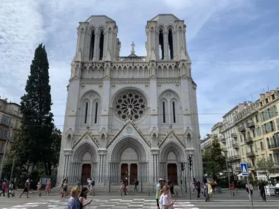a church with people walking in front of it at Hotel de Berne in Nice