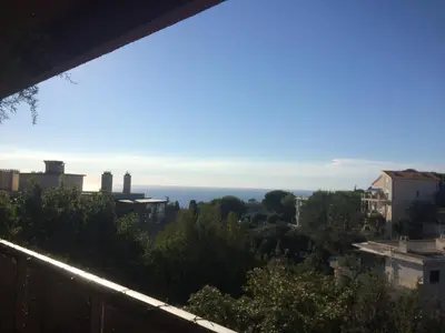 a view of the ocean from a balcony at AZURELLE in Nice