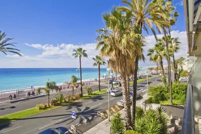 an aerial view of a street with palm trees and the ocean at PROMENADE HOLIDAY - CARIATIDE PROMENADE SEA VIEW in Nice