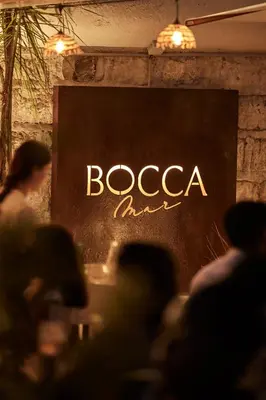a black sign with the word boaccia on it at Hotel Villa Victoria in Nice