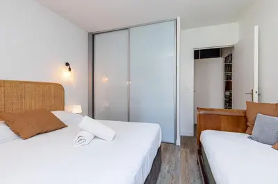 a bedroom with two beds and a window at 2 Bdrs & Parking in the Old Town ! in Nice