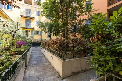 a garden in the middle of a building at 2 Bdrs & Parking in the Old Town ! in Nice