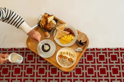 a tray of breakfast food on a table at Hotel Boréal Nice in Nice