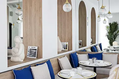 a living room with a bar with chairs and tables at Le Riviera Collection, Signature Collection by Best Western in Nice
