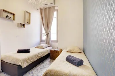 a bedroom with two beds and a window at Le Philibert - SPLENDID, 6 BEDROOMS, 12P, NICE PORT, Air Cond in Nice