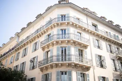 a large white building with a balcony at Best Western Premier Hotel Roosevelt in Nice