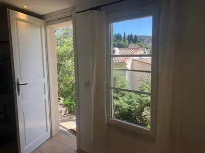 an open door to a window with a view at Petite chambre indépendante avec sdb, clim et parking privé in Nice