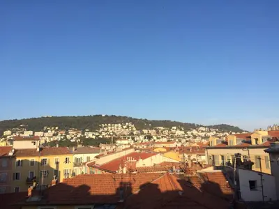 a view of a town with houses and roofs at Garibaldi mansardé in Nice