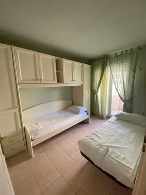 a bedroom with two beds and a window at Palais des Arts, Proche Tram et Promenade in Nice