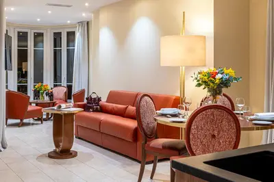 a living room with a couch and a table at Résidence Aston la Scala in Nice