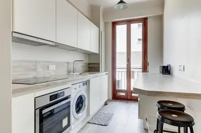 a kitchen with a washer and dryer in a room at PROMENADE HOLIDAY - PALATIN PROMENADE in Nice