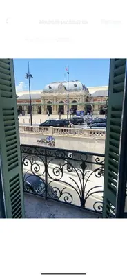 a view of a building from an open window at Interlaken in Nice