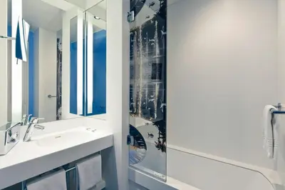 a bathroom with a sink and a shower at Nice Centre Hotel in Nice