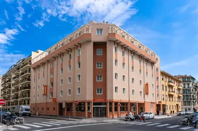a large building on the corner of a street at easyHotel Nice Old Town in Nice