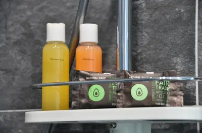 a shelf with two bottles of disinfectants and toothpaste at STUDIO PROMENADE FLORIDA BEACH in Nice