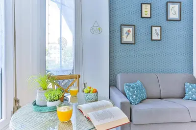 a living room with a couch and a glass table at MY CASA - GROSSO 14 - 5 min walk to beach in Nice