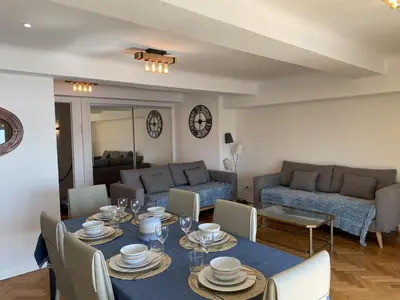 a living room with a table and a couch at PROMENADE HOLIDAY - OLD TOWN PANORAMIC in Nice