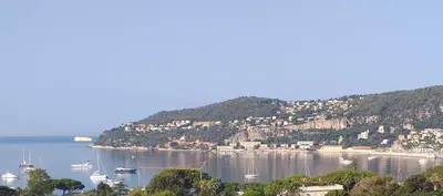a view of a bay with boats in the water at Vue mer exceptionnelle entre Nice et Monaco in Villefranche-sur-Mer