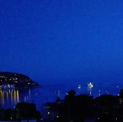 a view of the ocean at night at Vue mer exceptionnelle entre Nice et Monaco in Villefranche-sur-Mer