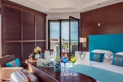 a hotel room with a table with wine glasses at Hotel Aston La Scala in Nice