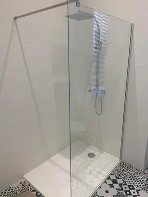 a shower with a glass door in a bathroom at Gustave in Nice