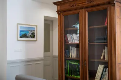 a wooden book shelf with books on it at 